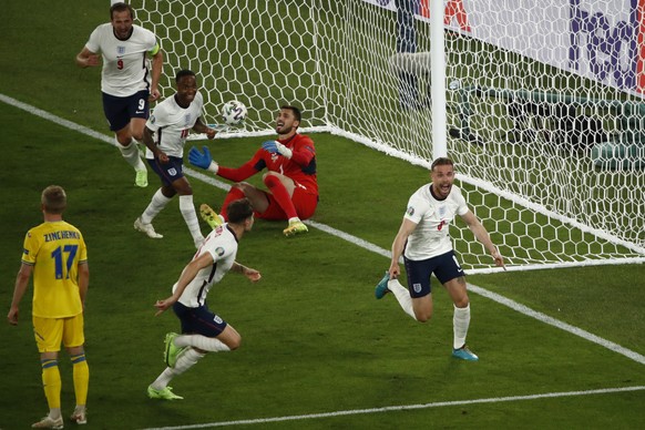 England&#039;s Jordan Henderson, right, celebrates after scoring his side&#039;s fourth goal during the Euro 2020 soccer championship quarterfinal match between Ukraine and England at the Olympic stad ...