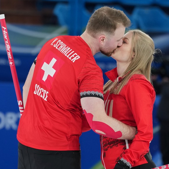 KEYPIX - Switzerland's Yannick Schwaller, left, celebrates with Briar Schwaller-Huerlimann, after winning the mixed doubles round robin phase of the curling competition against south Korea at the ...