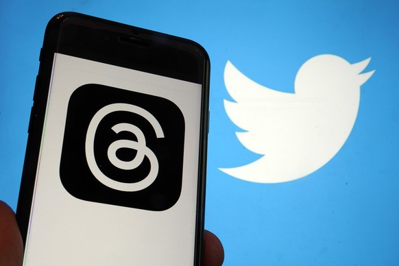 This photo, taken in New York on Wednesday, July 5, 2023, show the logo for Meta&#039;s new app Threads, left, and that of Twitter. Meta is poised to unveil the new app that appears to mimic Twitter ? ...