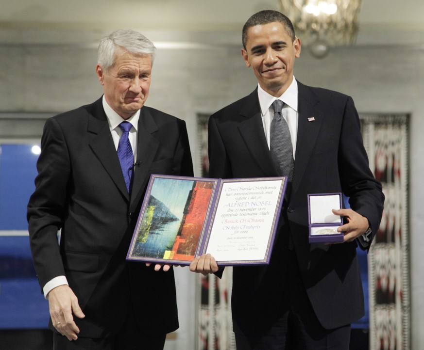 FILE - In this Dec. 10, 2009, file photo, President and Nobel Peace Prize laureate Barack Obama poses with his medal and diploma alongside Nobel committee chairman Thorbjorn Jagland at the Nobel Peace ...