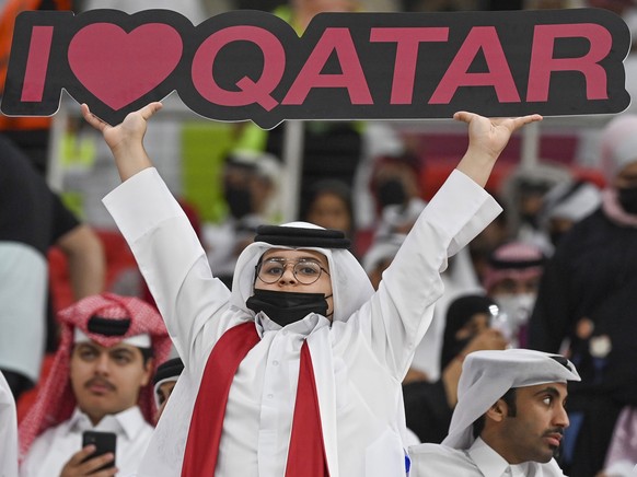 epaselect epa09634852 Supporters of Qatar cheer ahead of the FIFA Arab Cup quarter final match between Qatar and the United Arab Emirates at Al Bayt stadium in Al Khor, Qatar, 10 December 2021. EPA/No ...