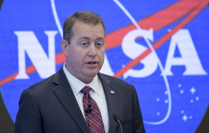 In this image provided by NASA, NASA Chief Financial Officer Jeff DeWit speaks during a news conference Friday, June 7, 2019, in New York. NASA announced Friday that it will open the International Spa ...