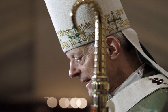 FILE - In this Wednesday, Oct. 20, 2010 file photo, Archbishop Donald Wuerl talks with the media after Mass at the Cathedral of Saint Matthew the Apostle in Washington. On Tuesday, Aug. 15, 2018, a Pe ...