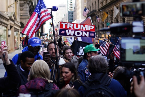 epa10557500 Supporters of former US president Donald J. Trump stand near Trump Tower in New York, New York, USA, 03 April 2023. After being indicted by a Manhattan grand jury last week, Trump traveled ...