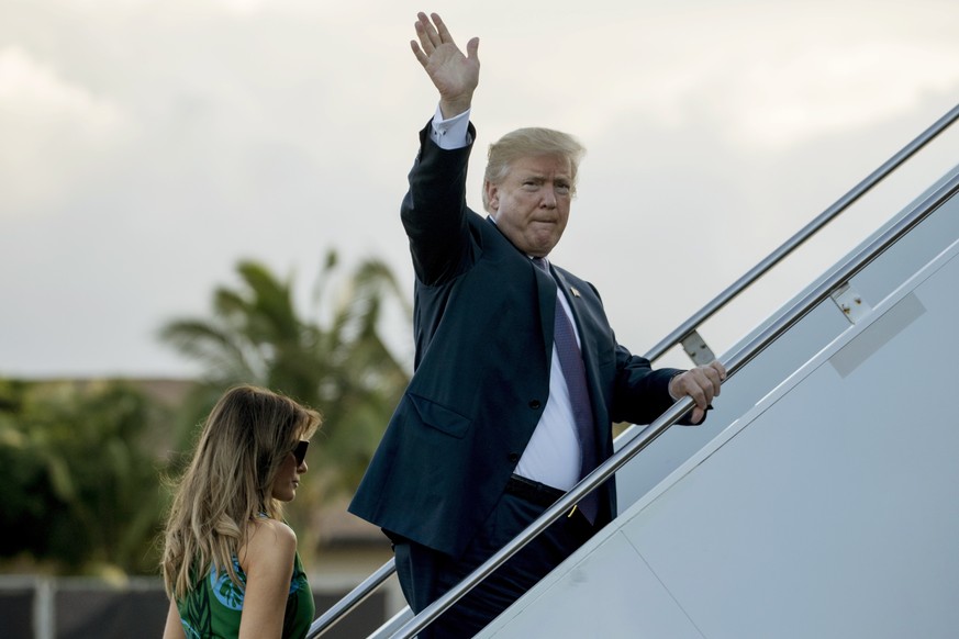 President Donald Trump and first lady Melania Trump board Air Force One at Joint Base Pearl Harbor Hickam, Hawaii, Saturday, Nov. 4, 2017, to travel to Yokota Air Base in Fussa, Japan. Trump begins a  ...