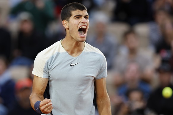 Spain&#039;s Carlos Alcaraz clenches his fist after scoring a point against Spain&#039;s Albert Ramos-Vinolas during their second round match at the French Open tennis tournament in Roland Garros stad ...