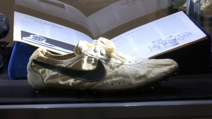 This image taken from video shows the Nike handmade Moon Shoe, designed by Nike co-founder Bill Bowerman in 1972, on display in New York on Friday, July 12, 2019. The sneaker is among 100 pairs of rar ...