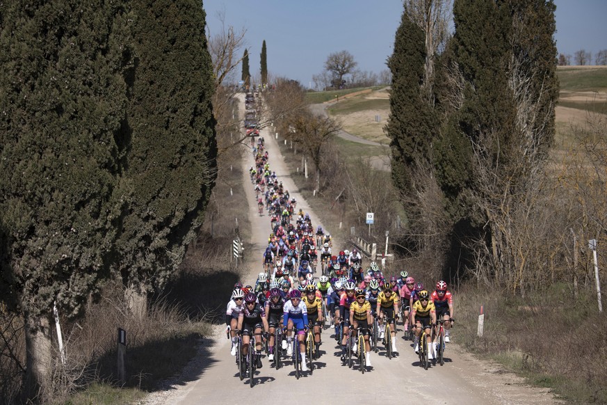 Cyclists make their way during the Strade Bianche (White Roads) cycling race, along Tuscany&#039;s countryside in Siena, Italy, Saturday, March 4, 2023. (Marco Alpozzi/LaPresse via AP)
