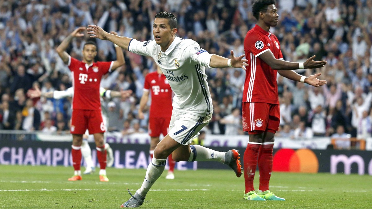 epa05914132 Real Madrid's Portuguese striker Cristiano Ronaldo (C) celebrates his second goal against Bayern Munich during the UEFA Champions League quarter final, second leg soccer match between ...