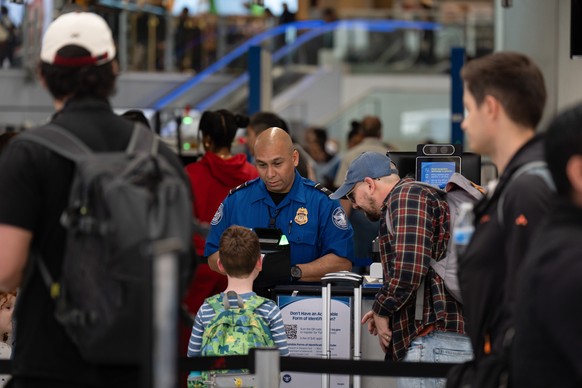 A TSA agent assists travelers at Los Angeles International Airport in Los Angeles, Friday, March 27, 2026. (AP Photo/Jae C. Hong)
Travel Delays