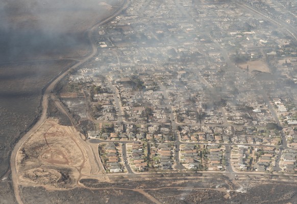 epa10792532 A handout photo made available by Carter Barto shows an arial view of buildings damaged in Lahaina, Hawaii as a result of a large wildfire which has killed 6 people and forced thousands of ...