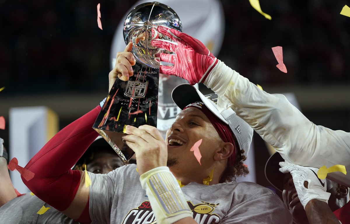 Kansas City Chiefs' Patrick Mahomes hoists the trophy after defeating the San Francisco 49ers in the NFL Super Bowl 54 football game Sunday, Feb. 2, 2020, in Miami Gardens, Fla. (AP Photo/David J ...