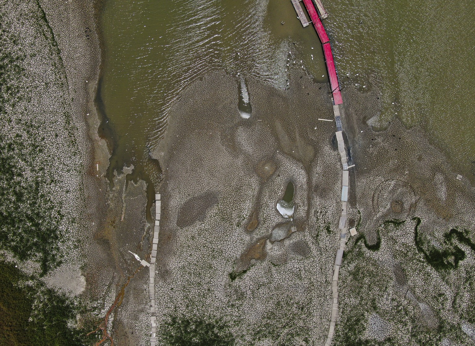 A view of The Boca reservoir that supplies water to the northern city of Monterrey is almost dry as the northern part of Mexico is affected by an intense drought, in Santiago, Mexico, Saturday, July 9 ...