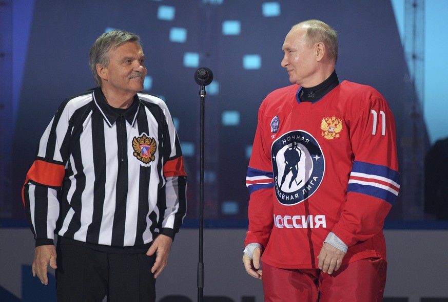 Russian President Vladimir Putin, right, and IIHF President Rene Fasel attend a gala match with the participation of Russian hockey legends as part of the final stage of the X All-Russian Night Hockey ...
