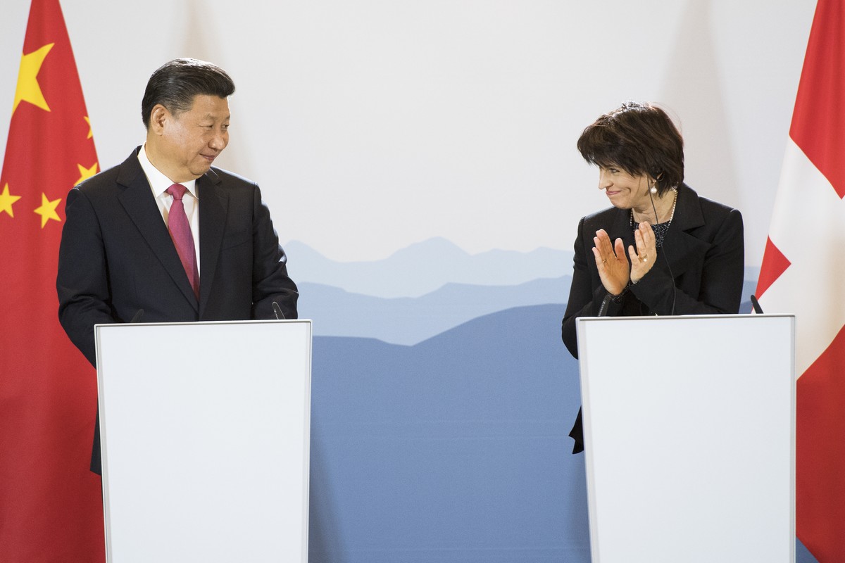 China's President Xi Jinping, left, and Swiss Federal President Doris Leuthard, right, speak during a Press Statements in the Hotel Bellevue Palace during a visit of China's President Xi Jin ...