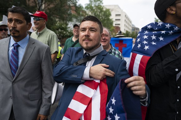 epaselect epa06946789 White supremacist Jason Kessler (C) and members of the alt-right march to the White House on the anniversary of last year's 'Unite the Right' rally in Washington,  ...