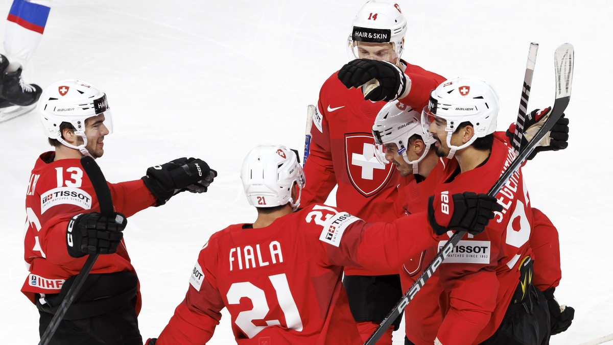 Switzerland's defender Jonas Siegenthaler, right, celebrates his goal with his teammates Switzerland's forward Nico Hischier #13, Switzerland's forward Kevin Fiala #21, Switzerland' ...