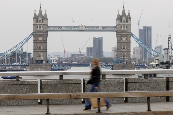 epa11696131 People walk across London Bridge, with Tower Bridge in the background, in London, Britain, 01 November 2024. The UK financial markets have been reacting to the new Labour government&#039;s ...