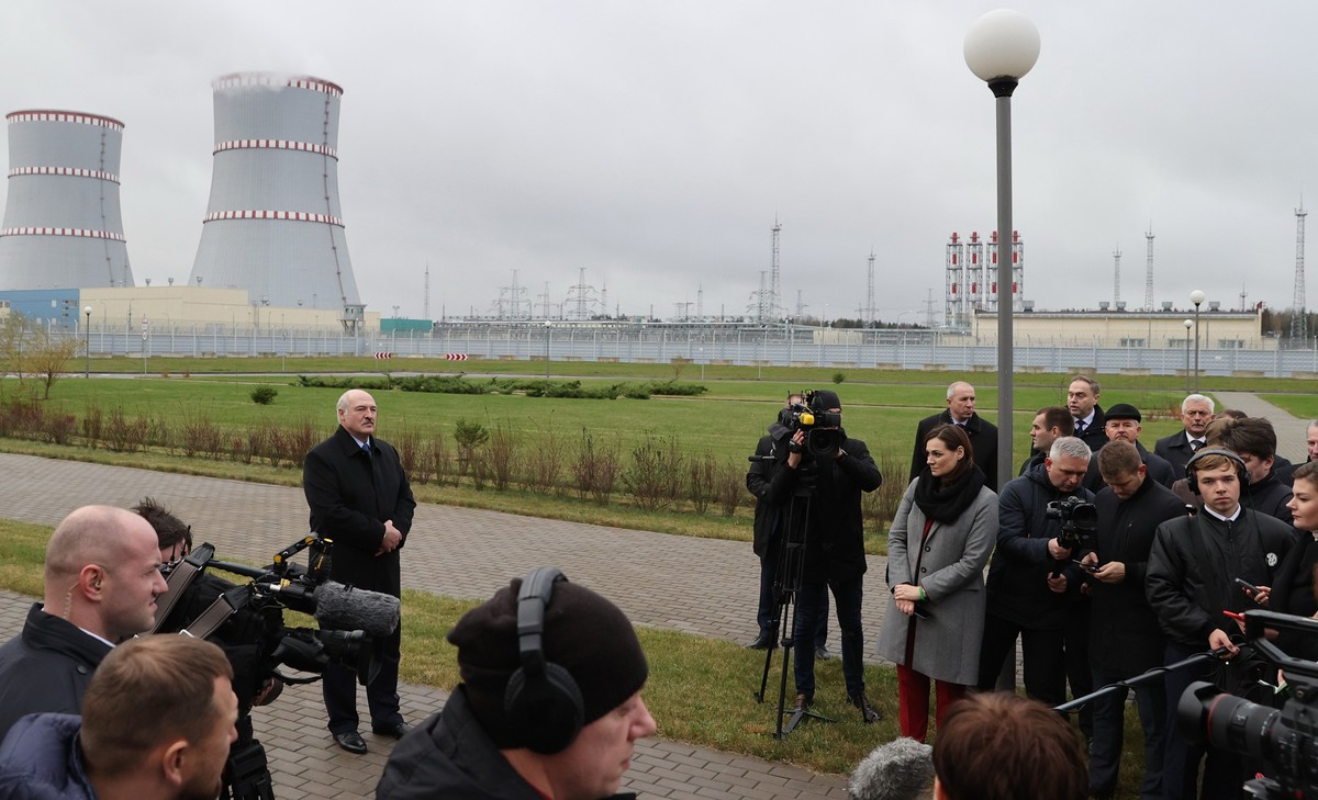 epa08804788 Belarusian President Alexander Lukashenko (C-L) talks to media, as he attends the first Belarusian Nuclear Power Plant (Belarusian NPP) during the plant's power launch event outside t ...