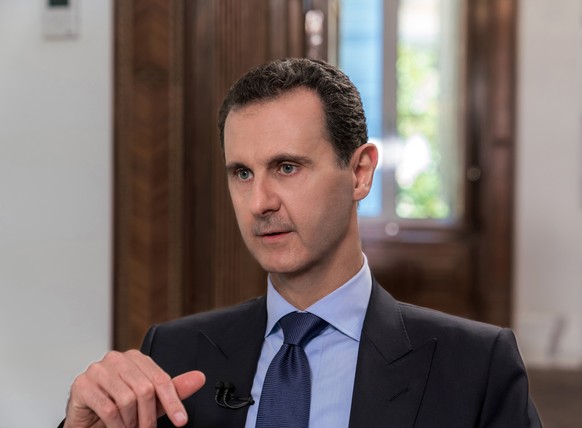 epa06837013 Syrian President Bashar al-Assad gives an interview to the Russian NTV Channel in Damascus, Syria, 24 June 2018. Assad affirmed that any constitutional reform in Syria should be done by a  ...