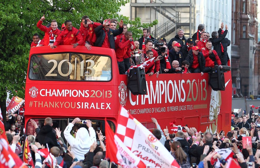 Mandatory Credit: Photo by Back Page Images/Shutterstock 2335005l Manchester United, ManU players celebrate with the trophy outside the town hall Manchester United Premier League Trophy parade, Manche ...