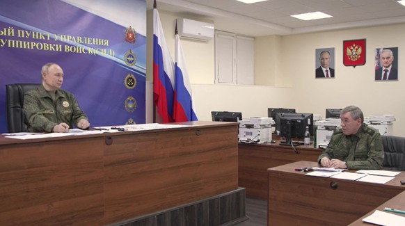 epa12483289 A handout photo made from video released by the Russian Presidential Press Office on 26 October 2025 shows, Russian President Vladimir Putin (L) and Chief of the General Staff of the Russi ...