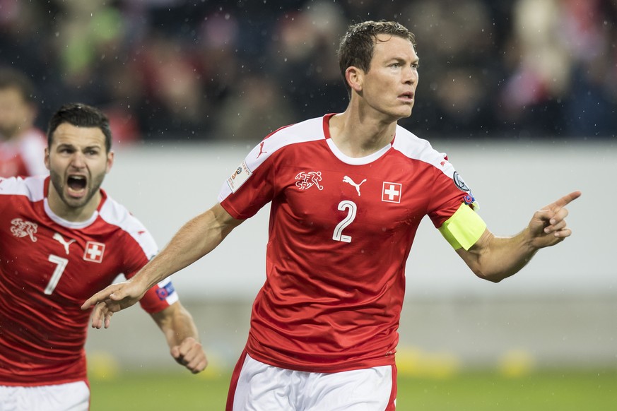 Swiss defender Stephan Lichtsteiner, right, celebrates after scoring a goal with Swiss forward Renato Steffen, left, during the 2018 Fifa World Cup group B qualification soccer match between Switzerla ...