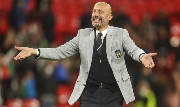 Gianluca Vialli, delegation chief of Italy, celebrates after winning the Euro 2020 soccer championship semifinal match against Spain at Wembley stadium in London, England, Tuesday, July 6, 2021. (Carl ...