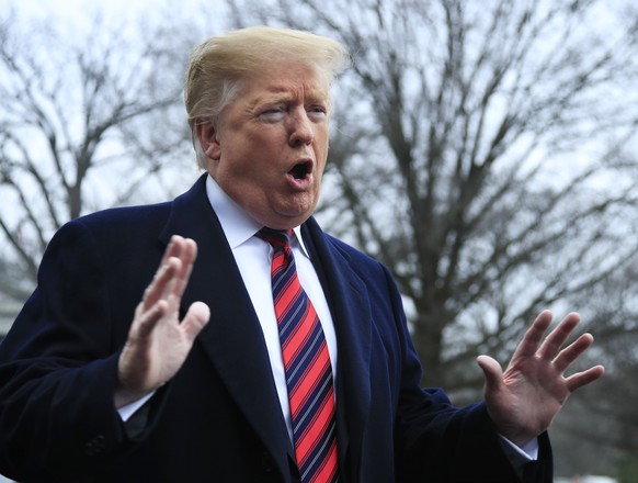 FILE - In this Jan. 19, 2019 file photo, President Donald Trump speak to reporters before leaving the White House in Washington. A federal judge has thrown out a lawsuit against President Trump by por ...