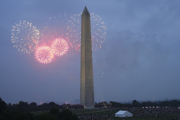 Fireworks are seen around the Washington Monument following a military parade commemorating the Army&#039;s 250th anniversary and coinciding with President Donald Trump&#039;s 79th birthday, Saturday, ...