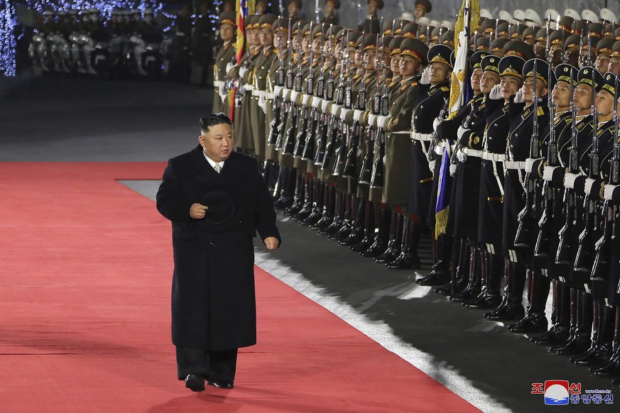 In this photo provided by the North Korean government, North Korean leader Kim Jong Un reviews an honor guard during a military parade to mark the 75th founding anniversary of the Korean People?s Army ...