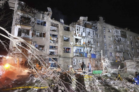 epa10790139 A handout photo made available by the National Police shows Ukrainian rescuers working at the site of a missile attack in the city of Pokrovsk, Donetsk region, eastern Ukraine, 08 August 2 ...