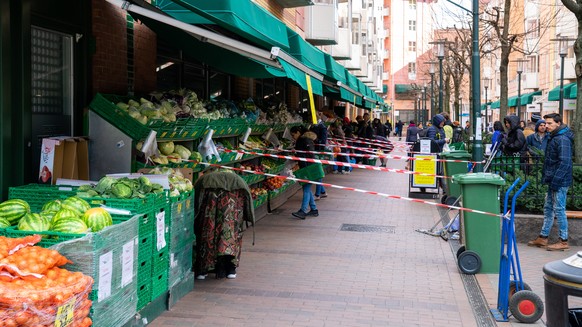 epa08353229 A fruit and vegetable supermarket at Gronland has set up a queue scheme in accordance with contagion rules during the COVID-19 pandemic, in Oslo, Norway, 03 April 2020 (issued 09 April 202 ...