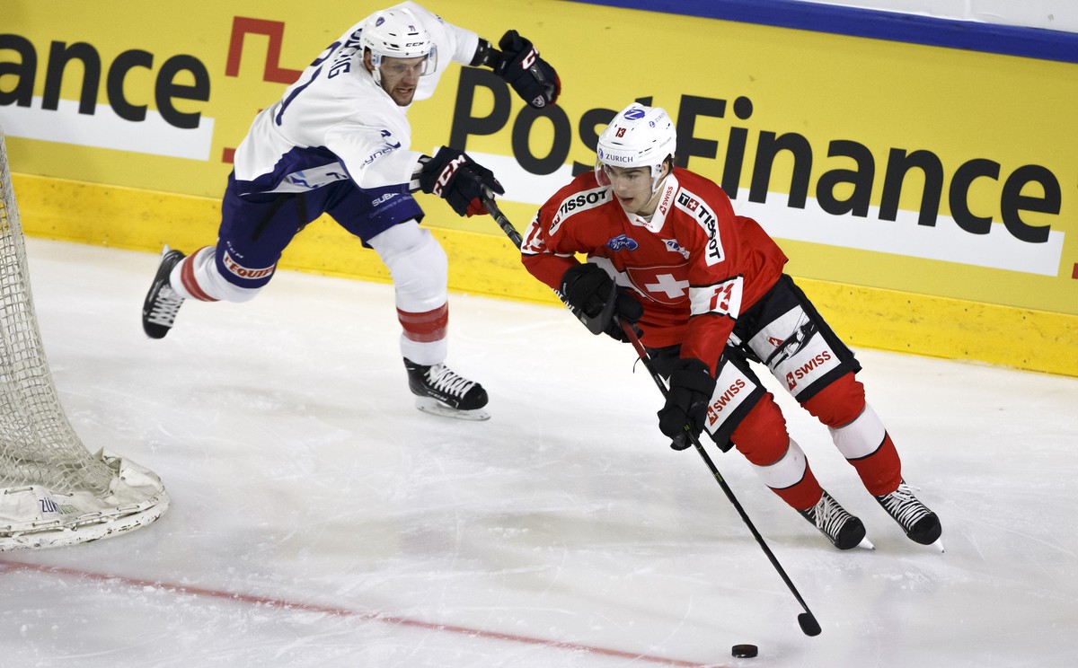 France's forward Anthony Guttig, left, vies for the puck with Switzerland's forward Nico Hischier, right, during a friendly international ice hockey game between Switzerland and France, at t ...