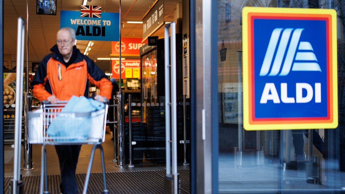 epa12704648 People leave an Aldi supermarket with their shoppings in east London, Britain, 04 February 2026. According to 'Which?' consumer group's analysis, Aldi has beaten Lidl and As ...