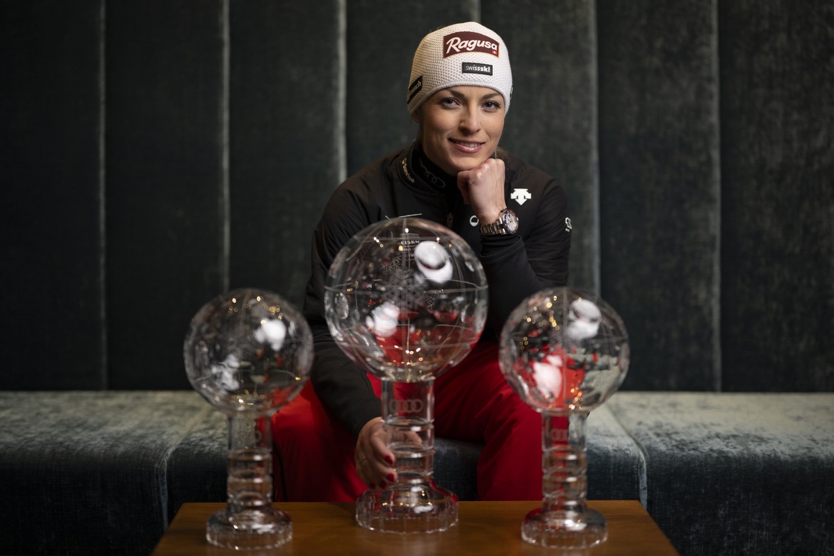 Lara Gut-Behrami poses with her crystal globes for Giant Slalom, Super-G and Overall World Cup, after the women's downhill race at the FIS Alpine Skiing World Cup finals in Saalbach-Hinterglemm,  ...
