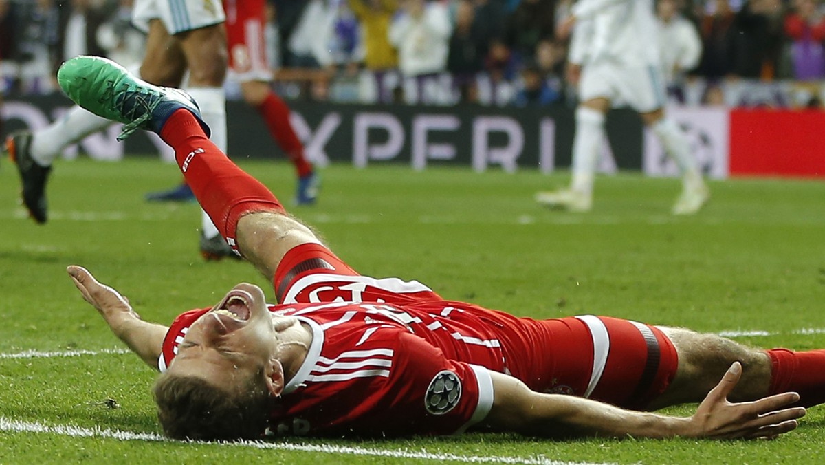 Bayern's Thomas Mueller reacts after Madrid reached its third straight Champions League final 4-3 on aggregate at the Champions League semifinal second leg soccer match between Real Madrid and FC ...