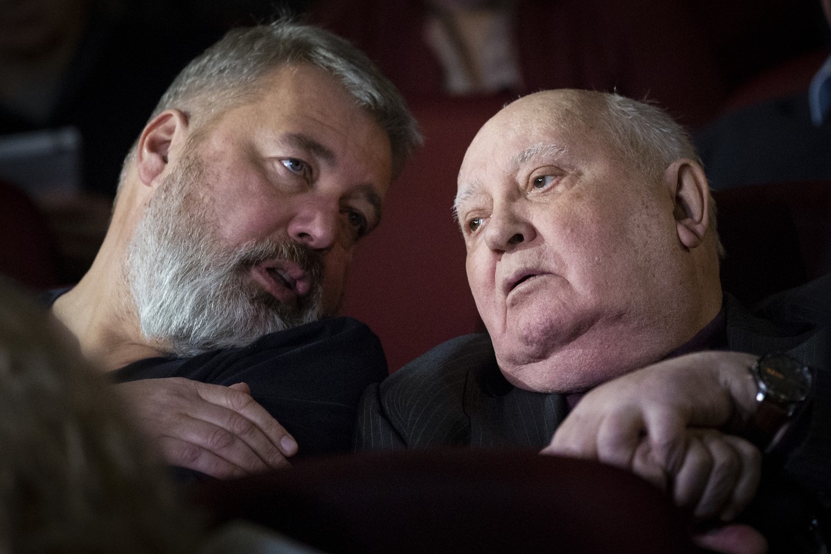 FILE - In this Nov. 8, 2018 file photo, former Soviet leader Mikhail Gorbachev, right, and Dmitry Muratov, former editor of Novaya Gazeta attend the Moscow premier of a film made by Werner Herzog and  ...