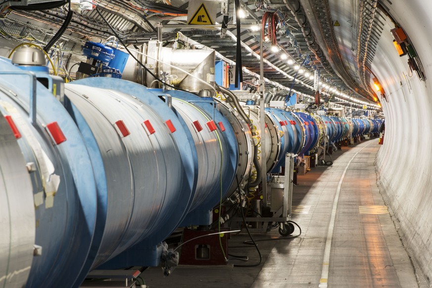 The LHC (Large Hadron Collider) tunnel at pt.4, pictured at CERN near Geneva, Switzerland, on June 12, 2014. The LHC tunnel is located about 100 meters underground (mean depth) below the French-Swiss  ...