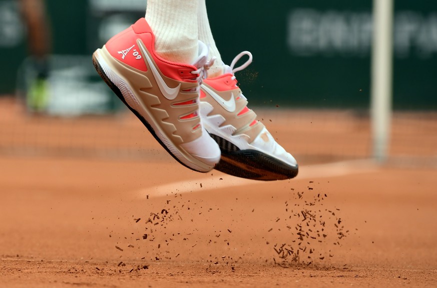 epaselect epa07610469 The shoes of Roger Federer of Switzerland as he plays Oscar Otte of Germany during their men’s second round match during the French Open tennis tournament at Roland Garros in Par ...