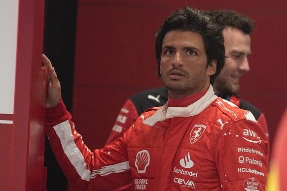 Ferrari driver Carlos Sainz, of Spain, waits in his garage before the start of the second practice session for the Formula One Las Vegas Grand Prix auto race, Friday, Nov. 17, 2023, in Las Vegas. (AP  ...