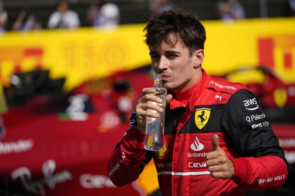 Ferrari driver Charles Leclerc of Monaco thumbs up after setting the pole position in the qualifying session at the Barcelona Catalunya racetrack in Montmelo, Spain, Saturday, May 21, 2022. The Formula One race will be held on Sunday. (AP Photo/Manu Fernandez)