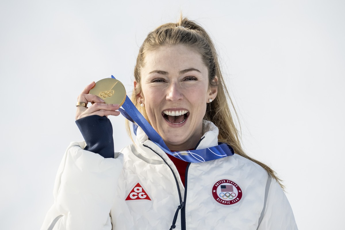 Gold medal winner Mikaela Shiffrin of the United States celebrates on the podium after the women's alpine skiing slalom race at the 2026 Olympic Winter Games in Cortina d'Ampezzo, Italy, on  ...