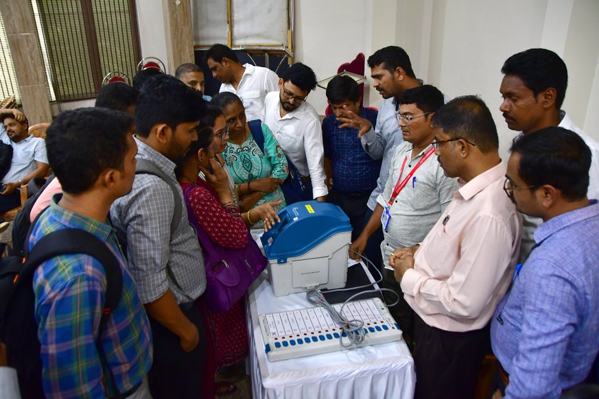 RECORD DATE NOT STATED MUMBAI, INDIA - APRIL 4: Polling officials for the upcoming Loksabha election attend a training session with an Electronic Voting Machine EVM in preparation for the ahead Loksab ...