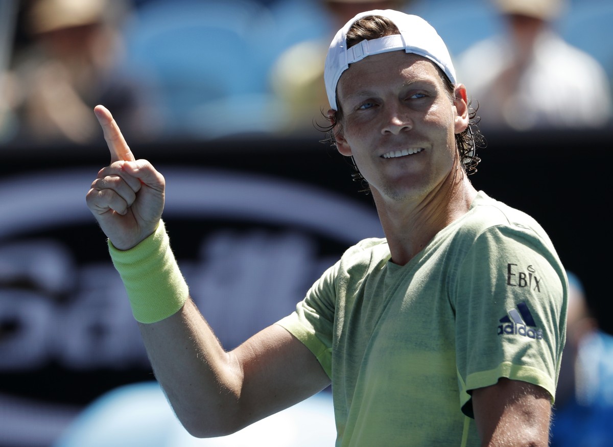 Tomas Berdych of the Czech Republic reacts after defeating Italy's Fabio Fognini during their fourth round match at the Australian Open tennis championships in Melbourne, Australia, Monday, Jan.  ...