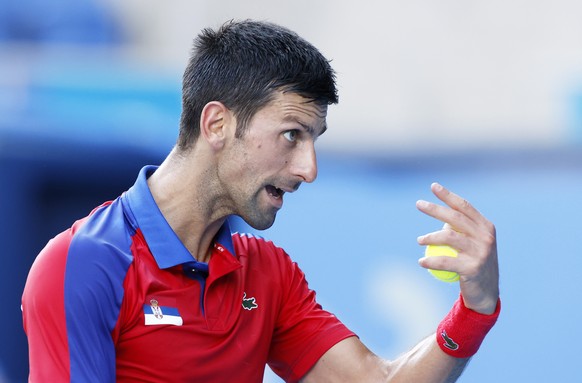 epa09381735 Novak Djokovic of Serbia reacts during the Men&#039;s singles Bronze medal match against Pablo Carreno Busta of Spain during the Tennis events of the Tokyo 2020 Olympic Games at the Ariake ...