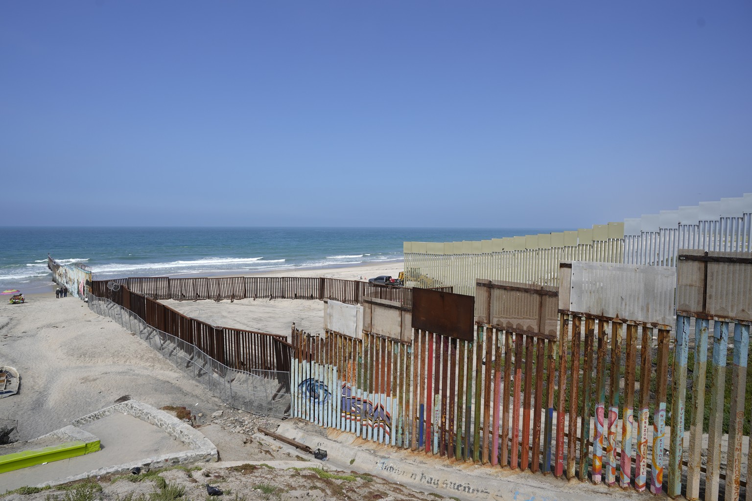 Construction continues on the border wall that separate the United States from Mexico, as seen from Tijuana, Mexico, Friday, Aug. 25, 2023. As the U.S. government built its latest stretch of border wa ...