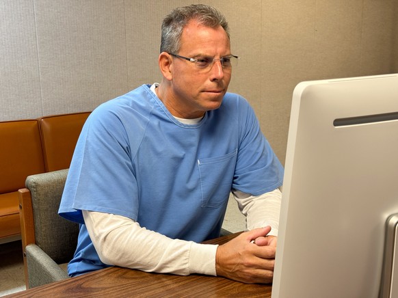 epa12315807 A handout photo made available by the California Department of Corrections shows Erik Menendez appearing before the parole board via teleconference from the Richard J. Donovan Correctional ...