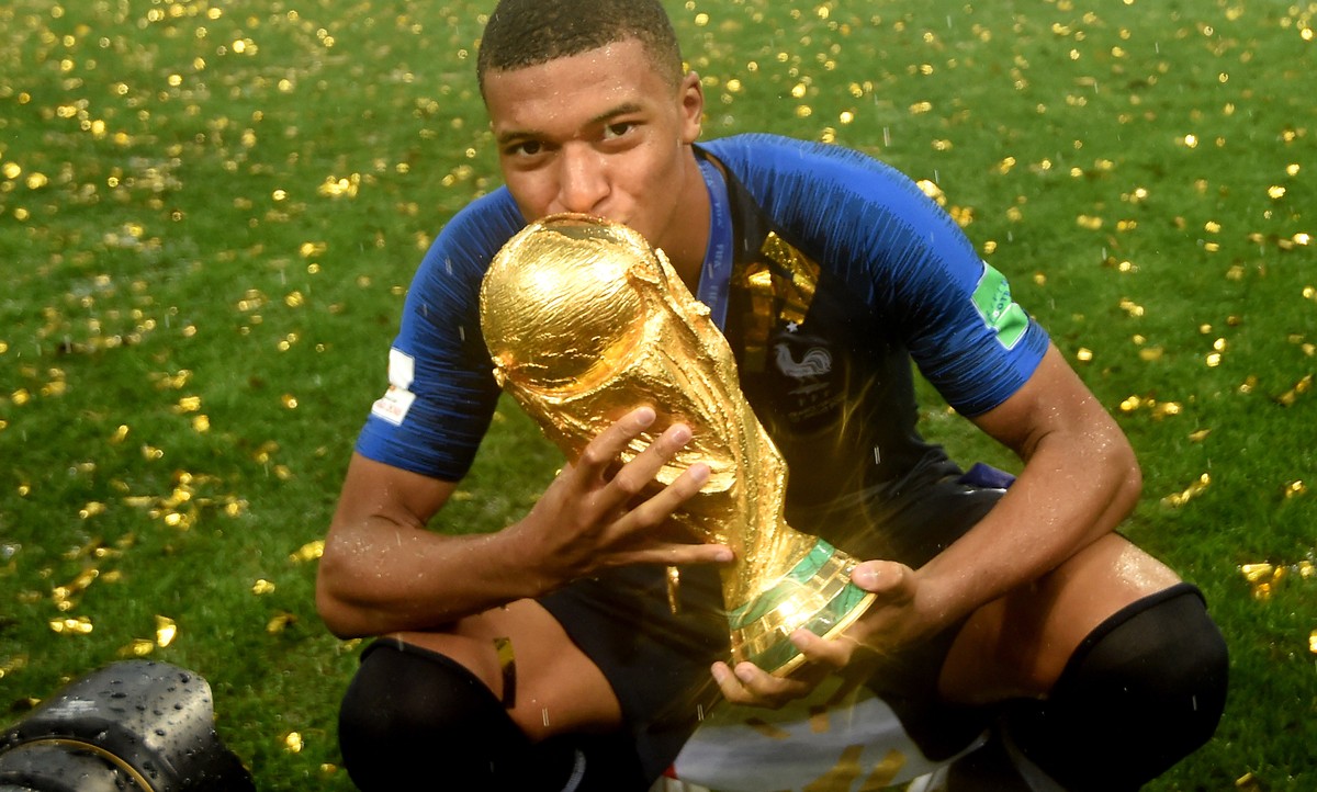 epa06891541 Kylian Mbappe of France reacts with the trophy after winning the FIFA World Cup 2018 final between France and Croatia in Moscow, Russia, 15 July 2018.

(RESTRICTIONS APPLY: Editorial Use ...