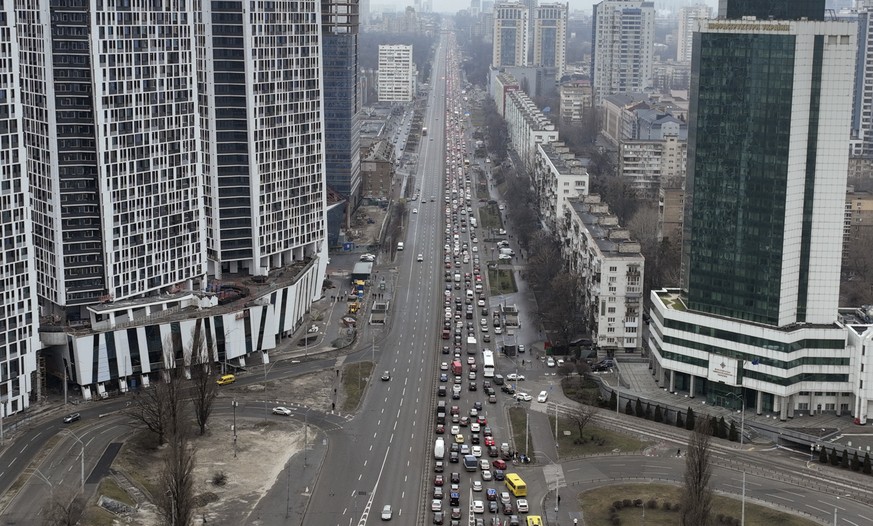 Traffic jams are seen as people leave the city of Kyiv, Ukraine, Thursday, Feb. 24, 2022. Russian President Vladimir Putin on Thursday announced a military operation in Ukraine and warned other countr ...